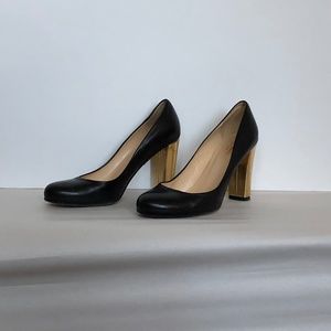 Round toe pumps with a chunky gold heel